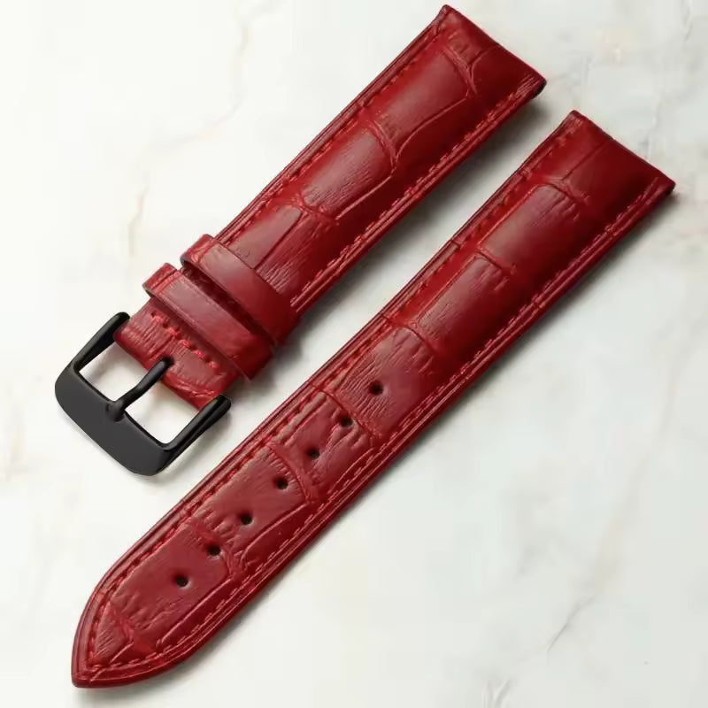 Red leather watch strap with croc print and black buckle