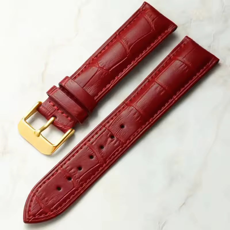 Red leather watch strap with croc print and gold buckle